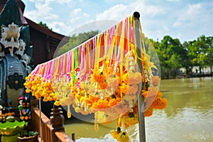 Marigold flower garland hang on colorful rails