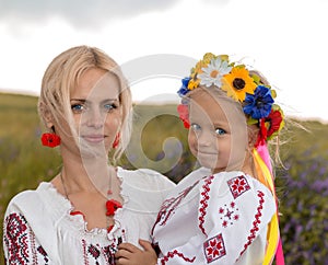 Mother and daughter in ukrainian national costumes photo