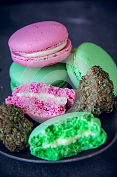 Marijuana Edibles On Spoon With Cannabis Nugs On Dark Slate Background. Vertical Selective Focus