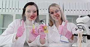 Marijuana scientists are smiling at the fruits of fruitful collaboration in research lab