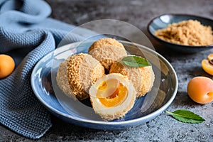 MarillenknÃ¶del â€“ sweet dumplings stuffed with apricot and coated with breadcrumbs