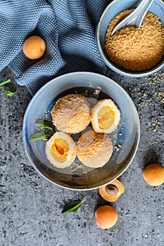 MarillenknÃ¶del â€“ sweet dumplings stuffed with apricot and coated with breadcrumbs