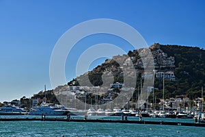 Marina in Andratx and houses on a hill