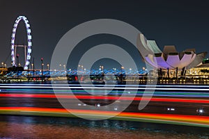 Marina bay sands buildings and Singapore flyer with light strip