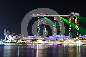 Marina Bay Sands hotel at night with light and laser show in Singapore