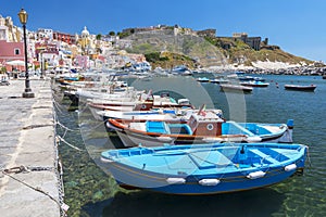 Marina Corricella with colourful boats and houses, Terra Murata, Procida Island, Bay of Naples, Italy.