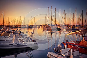 Marina with docked yachts at sunset