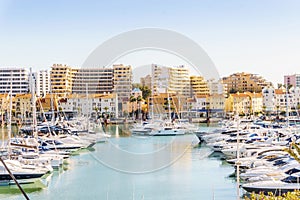 Marina full of luxurious yachts in touristic Vilamoura, Algarve, Portugal photo