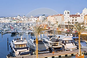 Marina with luxurious yachts and sailboats in touristic Vilamoura, Algarve, Portugal photo