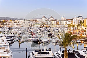 Marina with luxurious yachts and sailboats in touristic Vilamoura, Algarve, Portugal photo