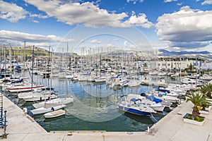 Marina with many yachts on the background of picturesque mountains