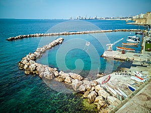 Marina with small boats on the coast on the seafront of Taranto in Italy.