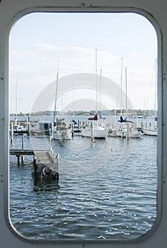 The Marina Yacht looking through a window .