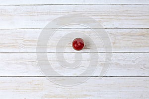 Marinara sauce in small bawl on wooden background, top view