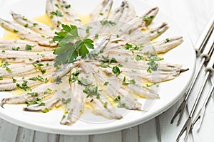 Marinated anchovies with olive oil and parsley