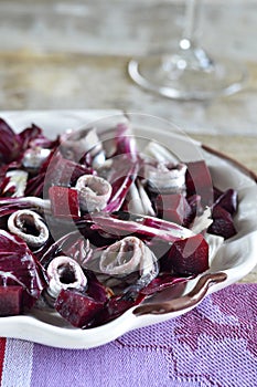 Marinated anchovies with salad of radicchio lettuc