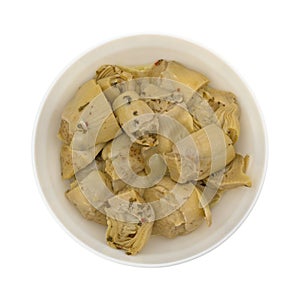 Marinated artichoke hearts in bowl top view