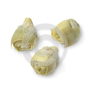 Marinated artichoke hearts on white background