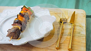 marinated beef kebabs with vegetables prepared on the grill