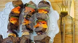 marinated beef kebabs with vegetables prepared on the grill