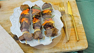 marinated beef kebabs with vegetables prepared on the grill