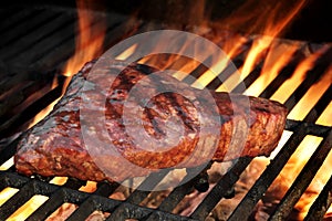 Marinated Beef Steak On The Flaming Hot BBQ Grill.