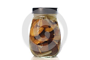 Marinated boletus mushrooms in glass jar