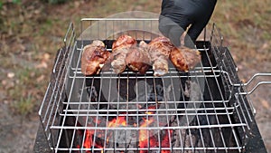 Marinated chicken legs fried on the flaming grill