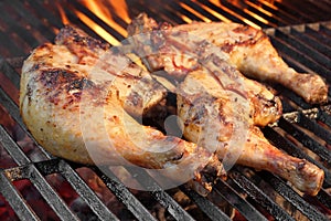 Marinated Chicken Legs Fried On The Hot Flaming BBQ Grill