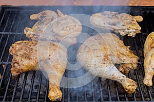 Marinated the chicken before placing it on the flaming charcoal grill to give it a rich, smoky flavor.