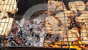 Marinated chicken wings grilling on a barbecue