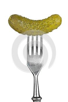Marinated cornichon on the fork