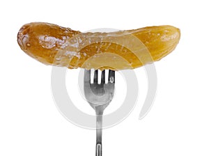 Marinated cornichon on the fork