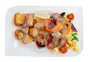 Marinated dogfish with sliced vegetables served on flat plate