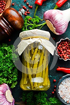 Marinated green asparagus in a glass jar. Vegetarian healthy food. Stocks of food.