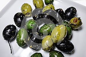 Marinated green and black olives