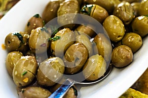 Marinated green olives in bowl