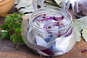 Marinated herring in a jar