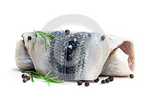 Marinated herring rolls with herbs isolated on white
