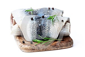 Marinated herring rolls with herbs isolated on white