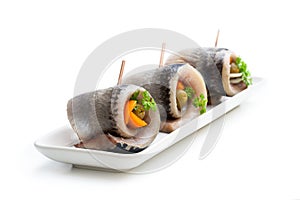 Marinated herring rolls with vegetables