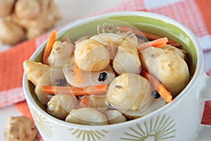 Marinated Jerusalem artichokes in bowl