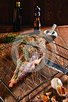 Marinated lamb leg with spice and herbs, olive oil and garlic