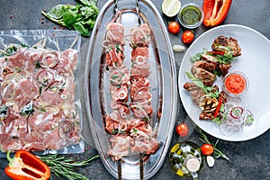 Marinated meat for barbecue. vacuum-packed and marinated meat, meat on a skewer and ready-made grilled meat with sauce on a plate