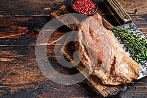 Marinated in mustard Marinate beef tri tip steak for bbq. Black background. Top view. Copy space