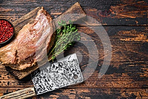 Marinated in mustard Marinate beef tri tip steak for bbq. Black background. Top view. Copy space