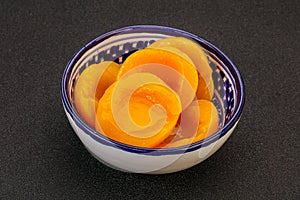 Marinated peaches fruit in the bowl