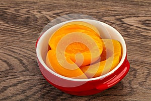 Marinated peaches fruit in the bowl