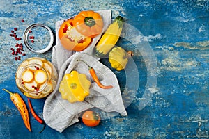 Marinated pickles preserving jars. Homemade yellow vegetables pickles. Fermented food. Top view