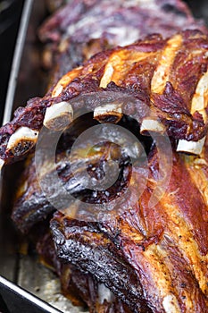 Marinated pork spare ribs, stack or pile of fresh grilled meat during barbeque, BBQ concept
